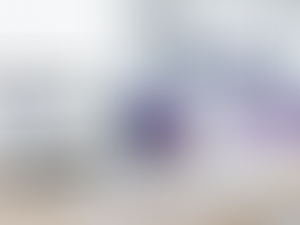 Eye-level view of a modern office workspace with a laptop and digital strategy notes