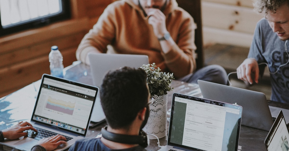 Two business professionals in a meeting — illustrating the nuanced difference between a recruiter and a headhunter