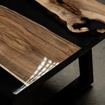Expensive vintage furniture. The table is covered with epoxy resin and varnished. Luxury q