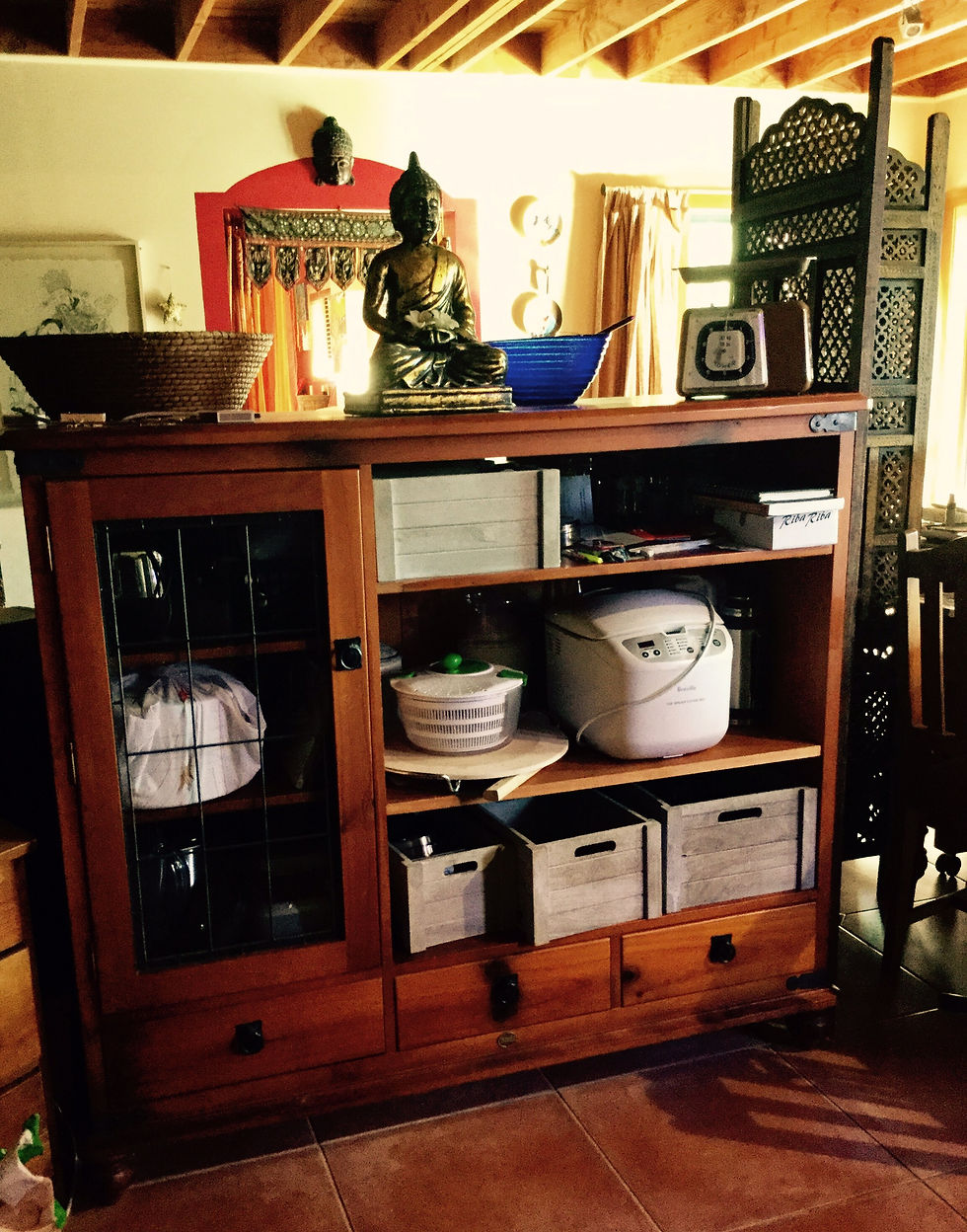 Another repurposed TV cabinet serves as additional kitchen storage.