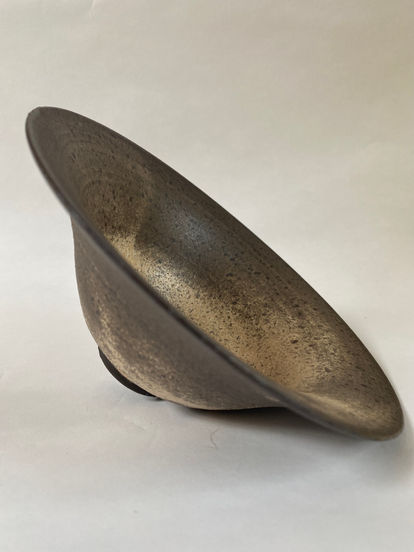 Bell shaped black clay bowl with blush rutile glaze 