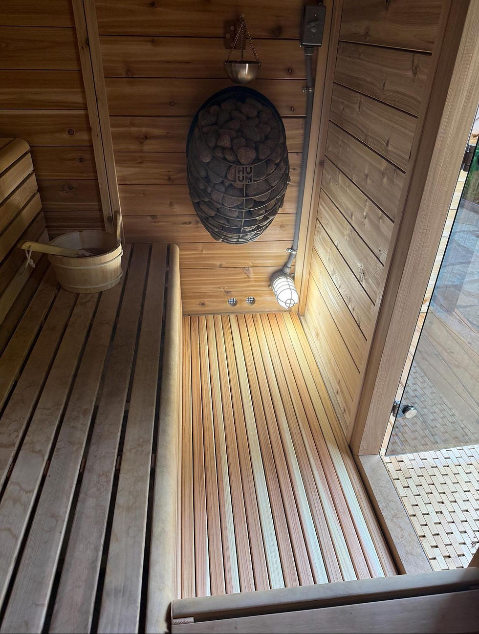 Wooden sauna interior with heater