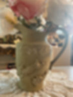 Playful bunnies aged upcycled water pitcher, front view