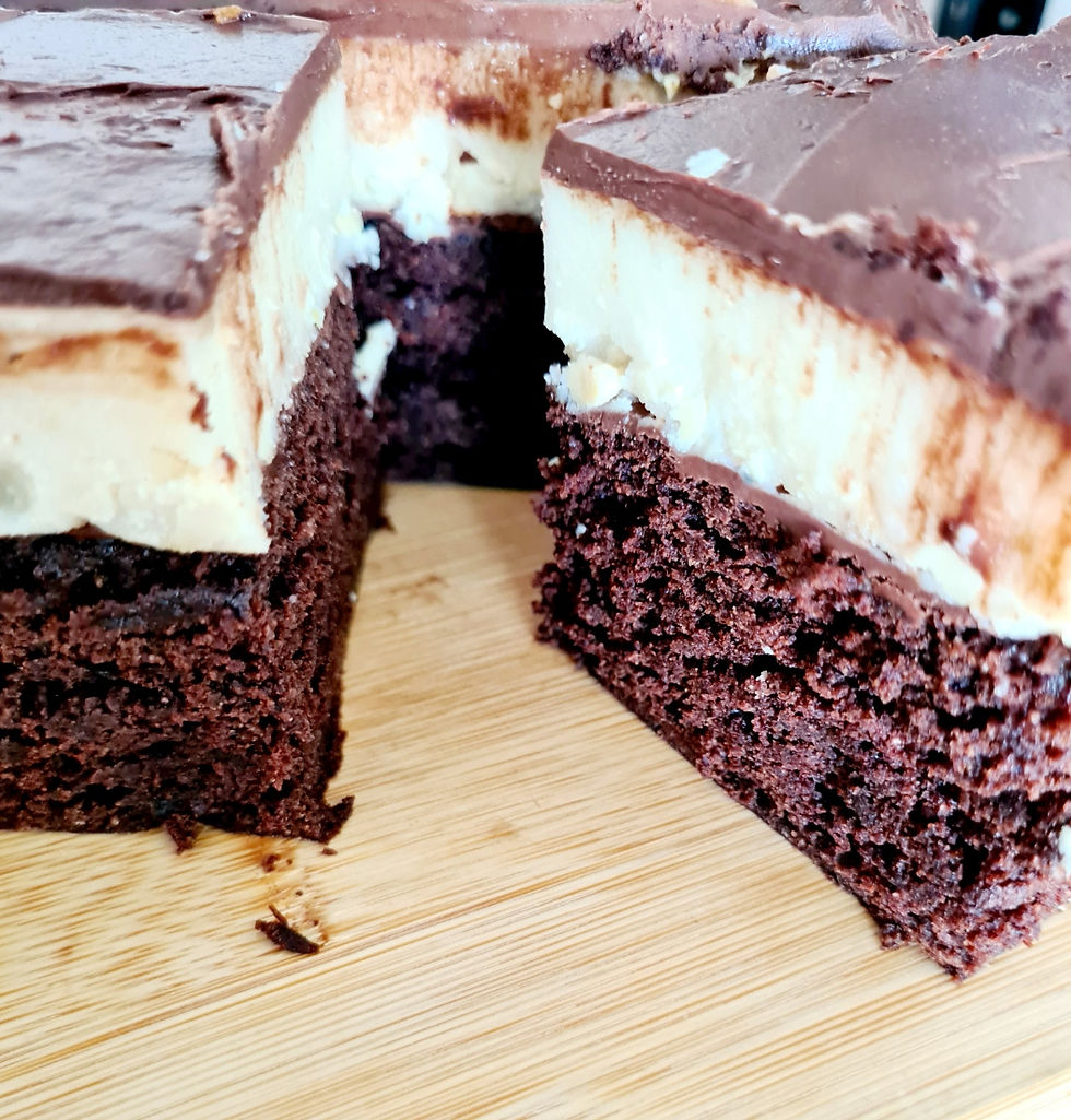Gluten-free and vegan cheesecake brownies with marbled vanilla swirls over rich chocolate