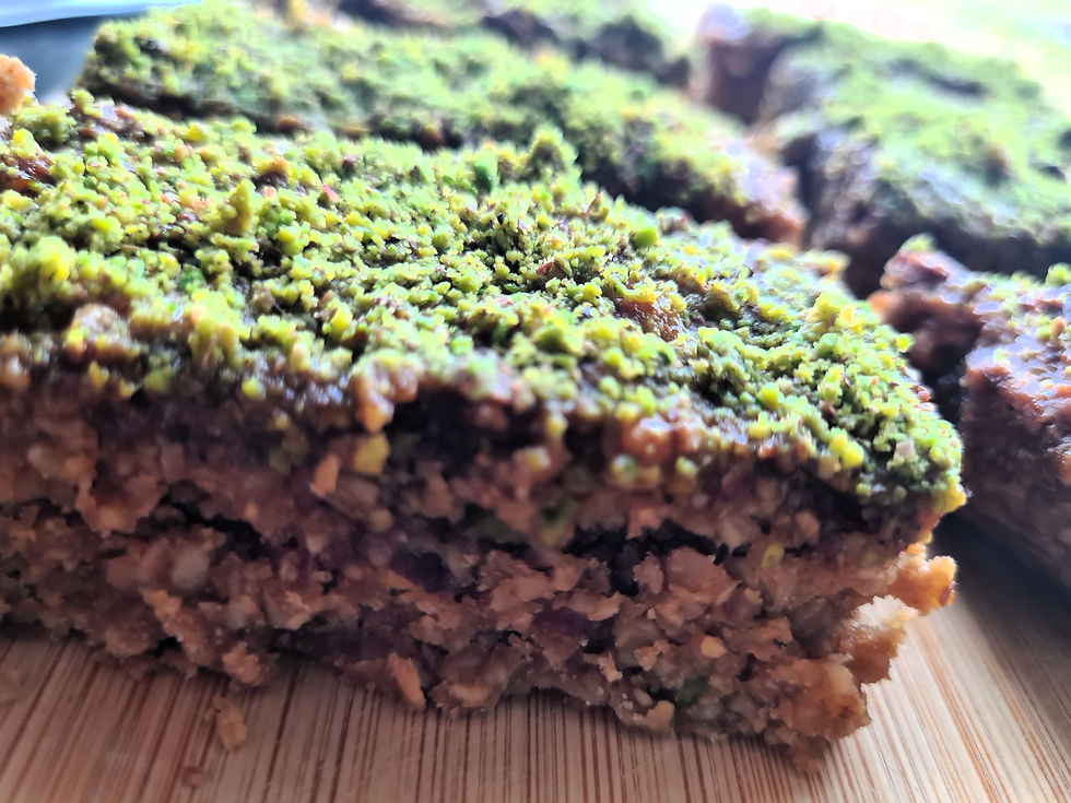 Close-up of pistachio baklava flapjack showing nut layers.