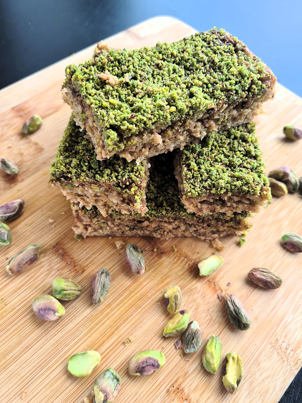 Golden pistachio baklava flapjack sliced into bars.