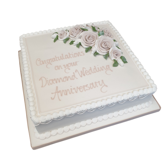 Bespoke 12-square cake decorated with intricate pink and white roses, crafted in Solihull, West Midlands.