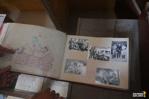 “Soviet-Armenian soldier’s album cover with photo and handwritten inscription.”
“Title page of Soviet soldier’s album, Ereván–Vapuiki, 1981–1983.”
“Hand-painted illustration of girls and cartoon character Wolf from ‘Ну, погоди!’ in soldier’s album.”
“Painting of a train entering a military boot, tearing it apart, from soldier’s album.”
“Photo of Soviet Minister of Defence Dmitri Ustinov with handwritten note in soldier’s album.”