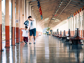 father and son at the train station.