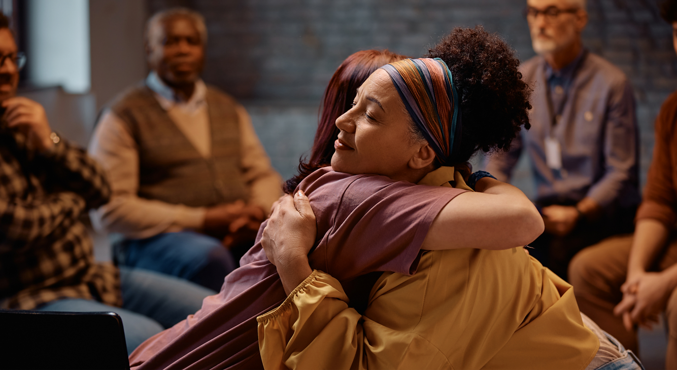 Supportive-women-embracing-during-group-therapy-at-mental-health-center_edited_edited_edit