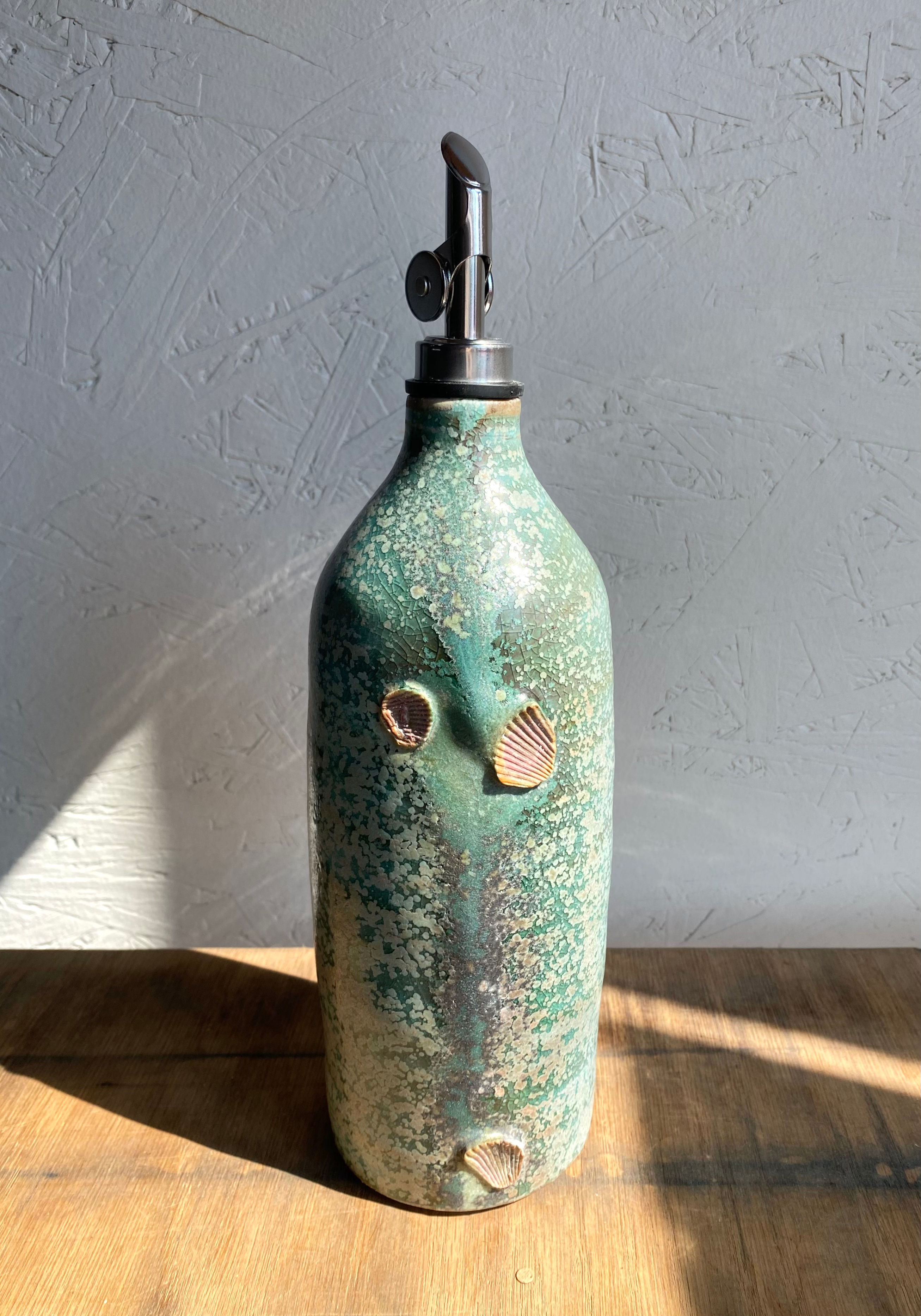 Teal blue oil dispenser 
