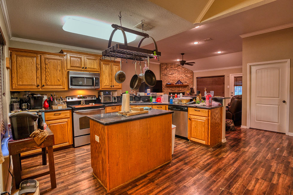A photo of a beautiful kitchen is ruined by clutter everywhere.
