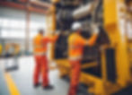 engineers fixing a big industrial machine with safety uniforms_edited.jpg
