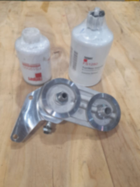 Fuel filter relocation bracket with duel filter head and filters