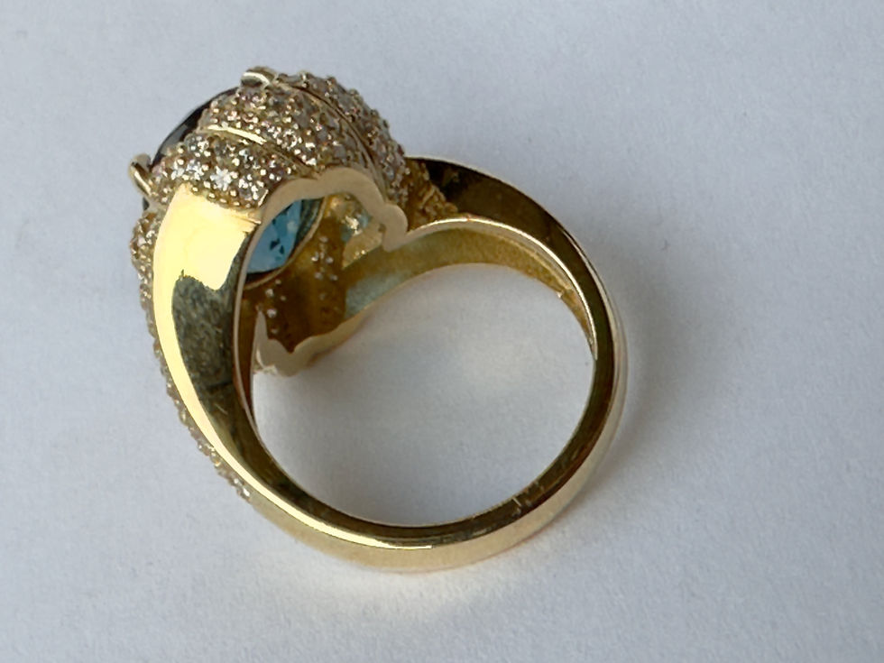 Thumbnail: 7 Carat Oval-Cut London Blue Topaz and Diamond Halo Ring in Yellow Gold