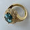 Thumbnail: 7 Carat Oval-Cut London Blue Topaz and Diamond Halo Ring in Yellow Gold