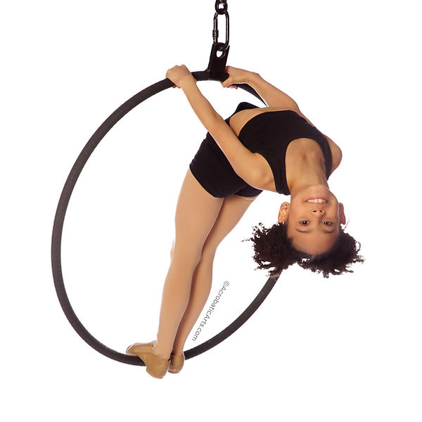 Kid standing on hoop.jpeg