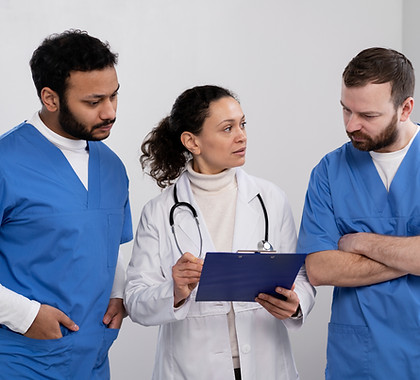 nurses-discussing-with-doctor-medium-shot.jpg