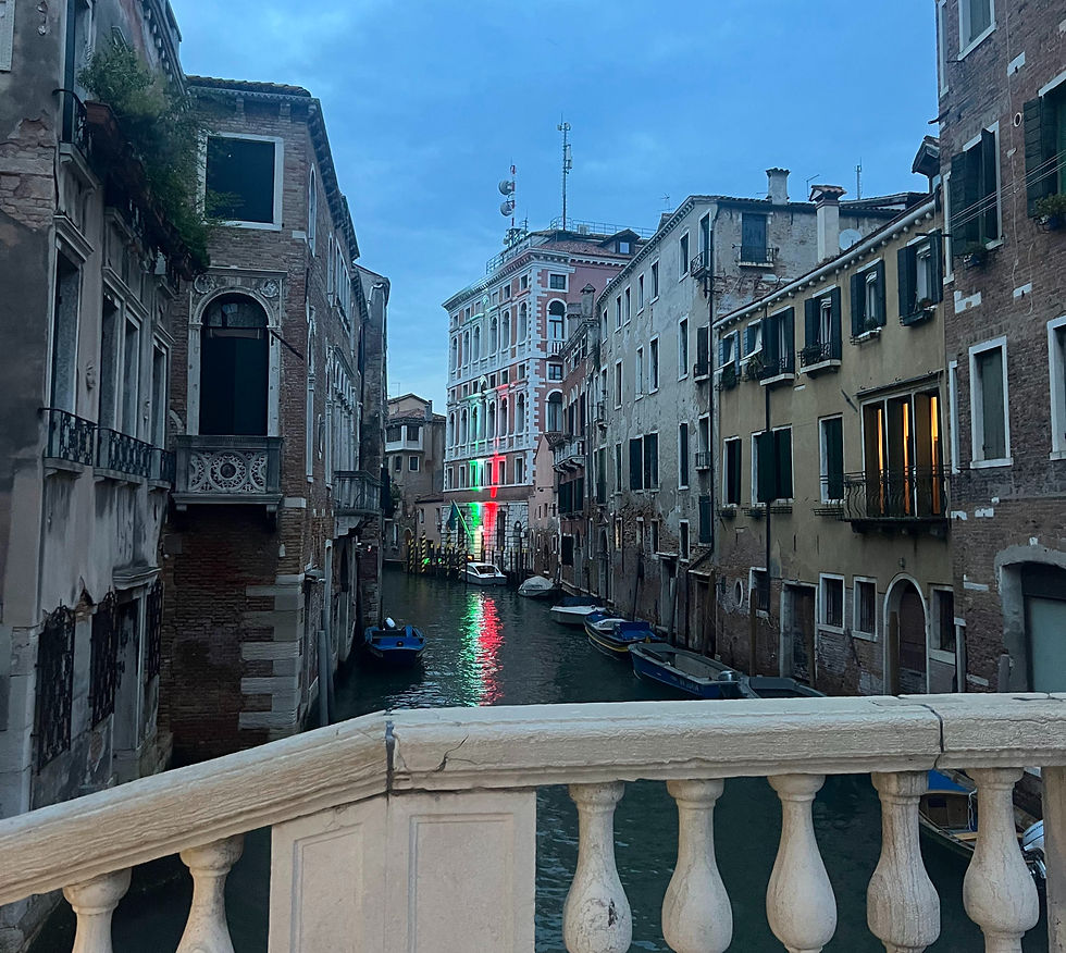 Lights reflecting on the water to look like the Italian flag