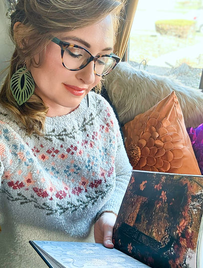 Jillian Aurora reading her recipe and poetry book Hearth and Heart
