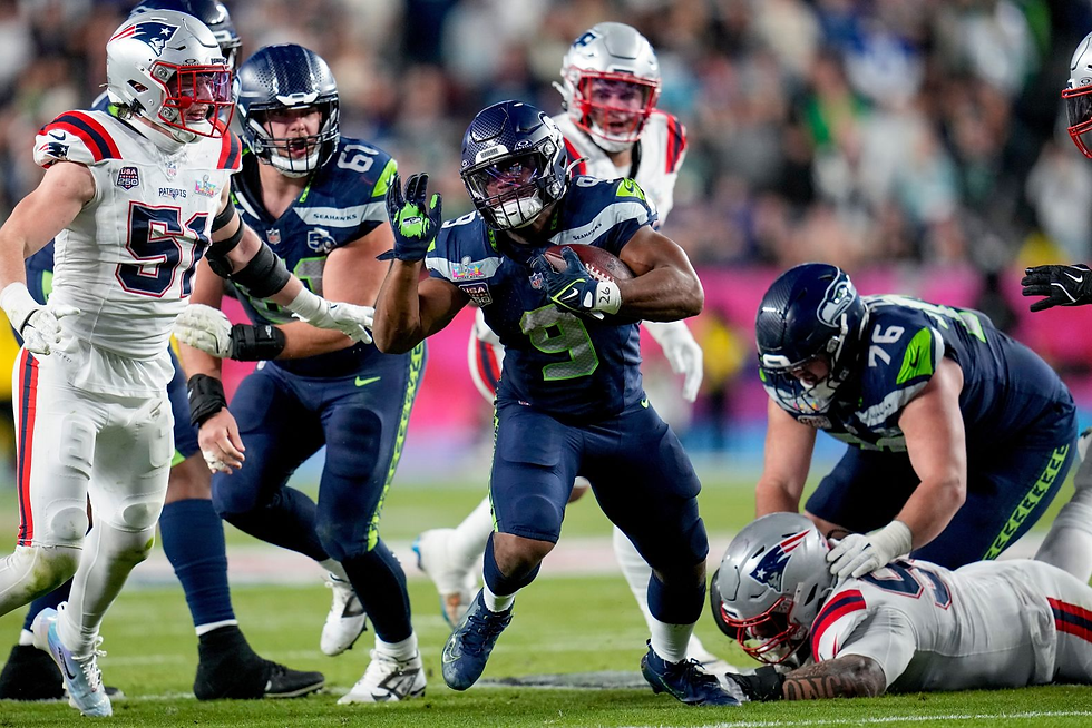 Seahawks running back and Super Bowl MVP Kenneth Walker III running the ball.