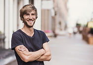 Smiling Man with Crossed Arms