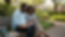 Eye-level view of two learners watching a lesson on a tablet outdoors