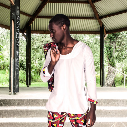 Captivating photoshoot in New Zealand with a male model showcasing strength and style, standing in the midst of nature's beauty
