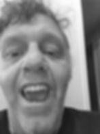 A customer with dentures augmented with vampire fangs.