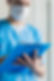 low-angle-nurse-male-with-clipboard.jpg