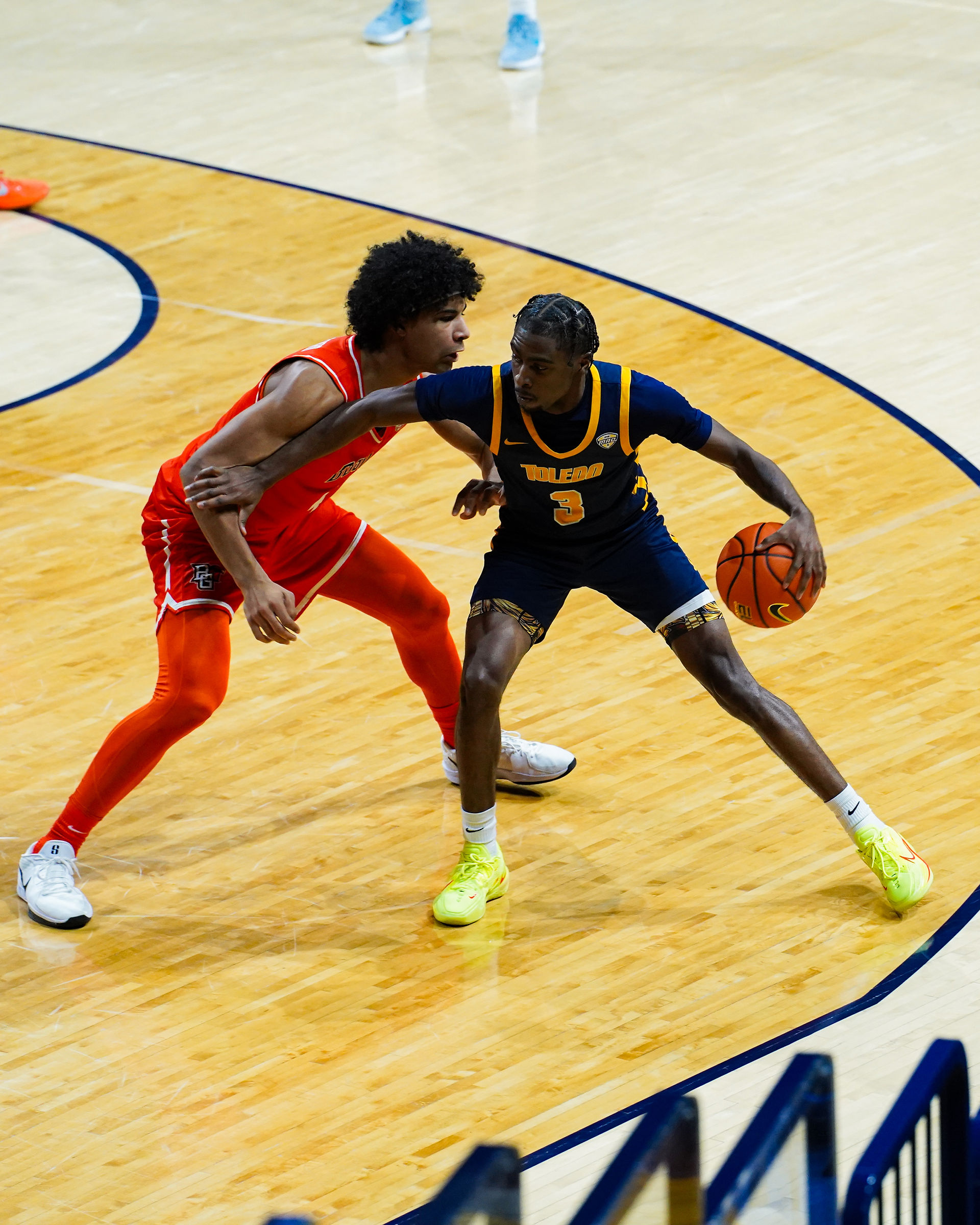 Toledo's Sony Wilson (No.3) is guarded by Bowling Green's Josiah Shackelford