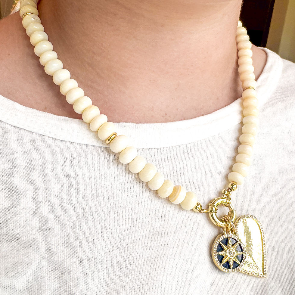 Thumbnail: Blakely Necklace worn with the Lapis Compass Charm and Goldy Dazzle Heart.