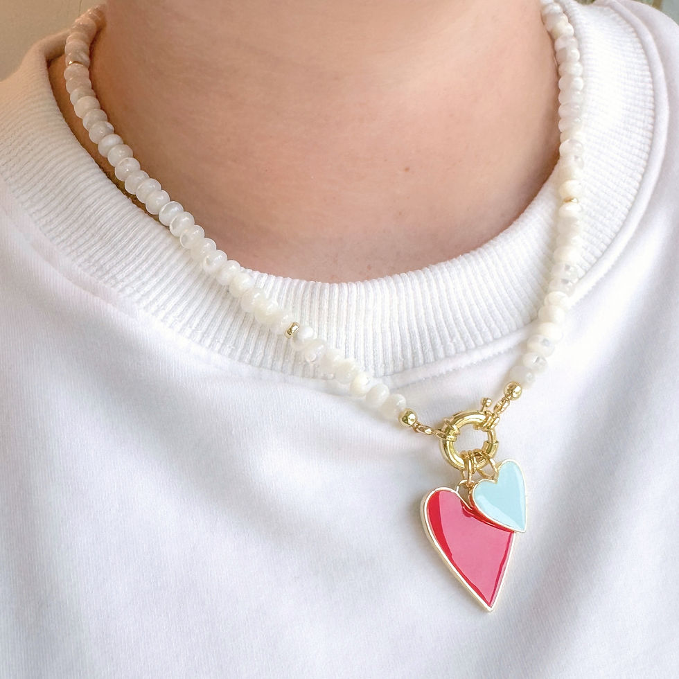 Thumbnail: Mini Darling Necklace worn with the Medium Have A Heart Charm in Red and Small Have A Heart Charm in Sky Blue.