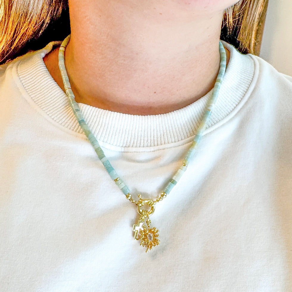 Thumbnail: Teeny Coastal Anemone Necklace styled on model with Bright Anemone and Pearly Cross charms