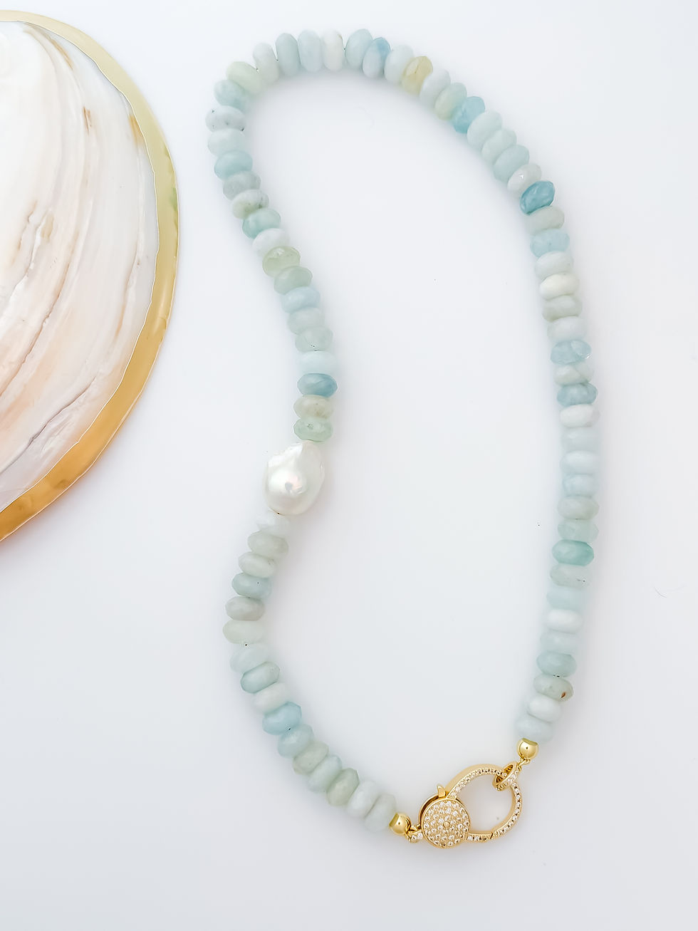 Thumbnail: Aquamarine Dreams II Necklace gold-filled pavé clasp detail with aquamarine beads with shell decor prop