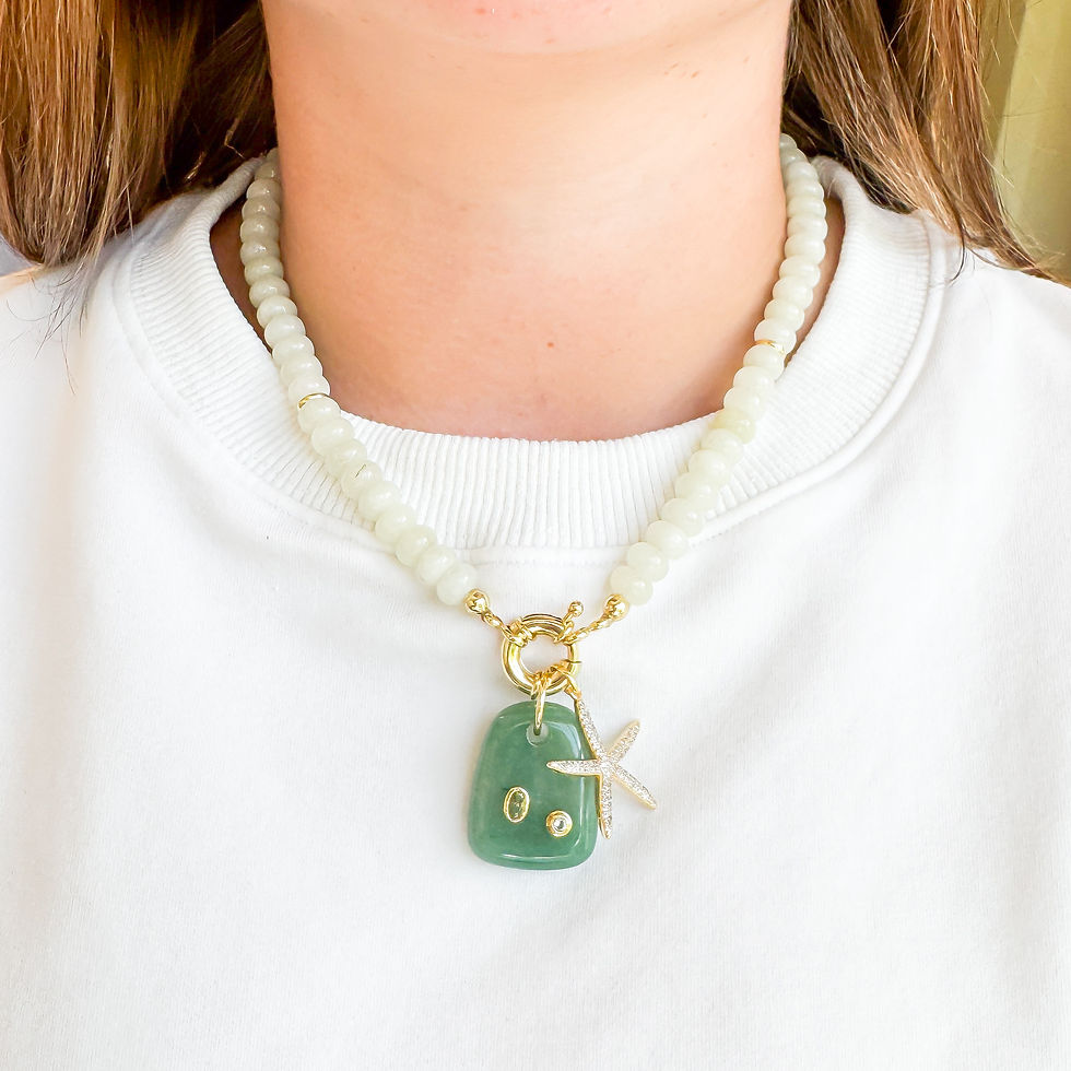 Thumbnail: Beachcomber Cove Necklace styled on model with Jade Tidepool and Isla Starfish charms