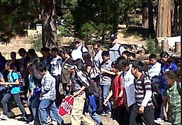 Kathy with staff and students at an outdoor workshop