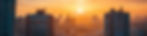 City skyline of high rise commercial and residential buildings at sunrise