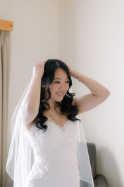 Bride admires herself in a mirror