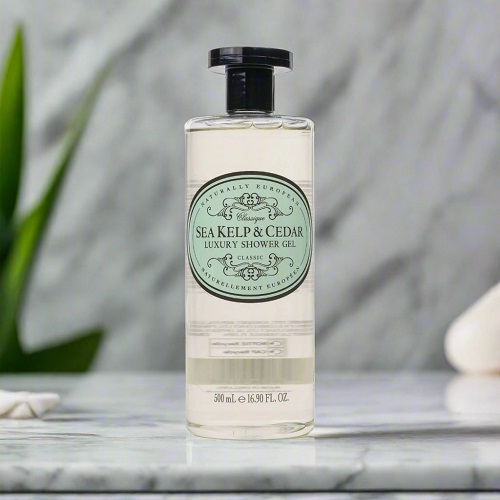 Naturally European Luxury Sea Kelp and Cedar Shower Gel on bathroom shelf.
