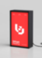 Urban Detailing logo design by Chinthaka Gunaratne presented on a red illuminated signboard, featuring a bold white monogram