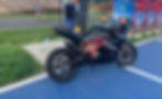 E-motorcycle charges at charging station