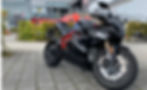 black electric motorcycle stands on the square in front of the Nürburgring