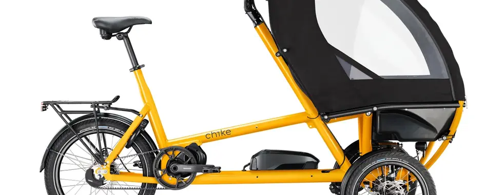 gelbes Lastenrad mit Sitz für Kind