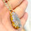 Thumbnail: Hamsa Hand Orgonite Necklace with Orange Aventurine & Blue Moonstone