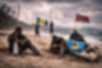 An illustration of distress washing ashore in Caribbean territories, where economic impacts heighten anxiety and the symbolic white flag joins national flags in calling nations to the table for a harmonised framework. This is an AI-generated image.