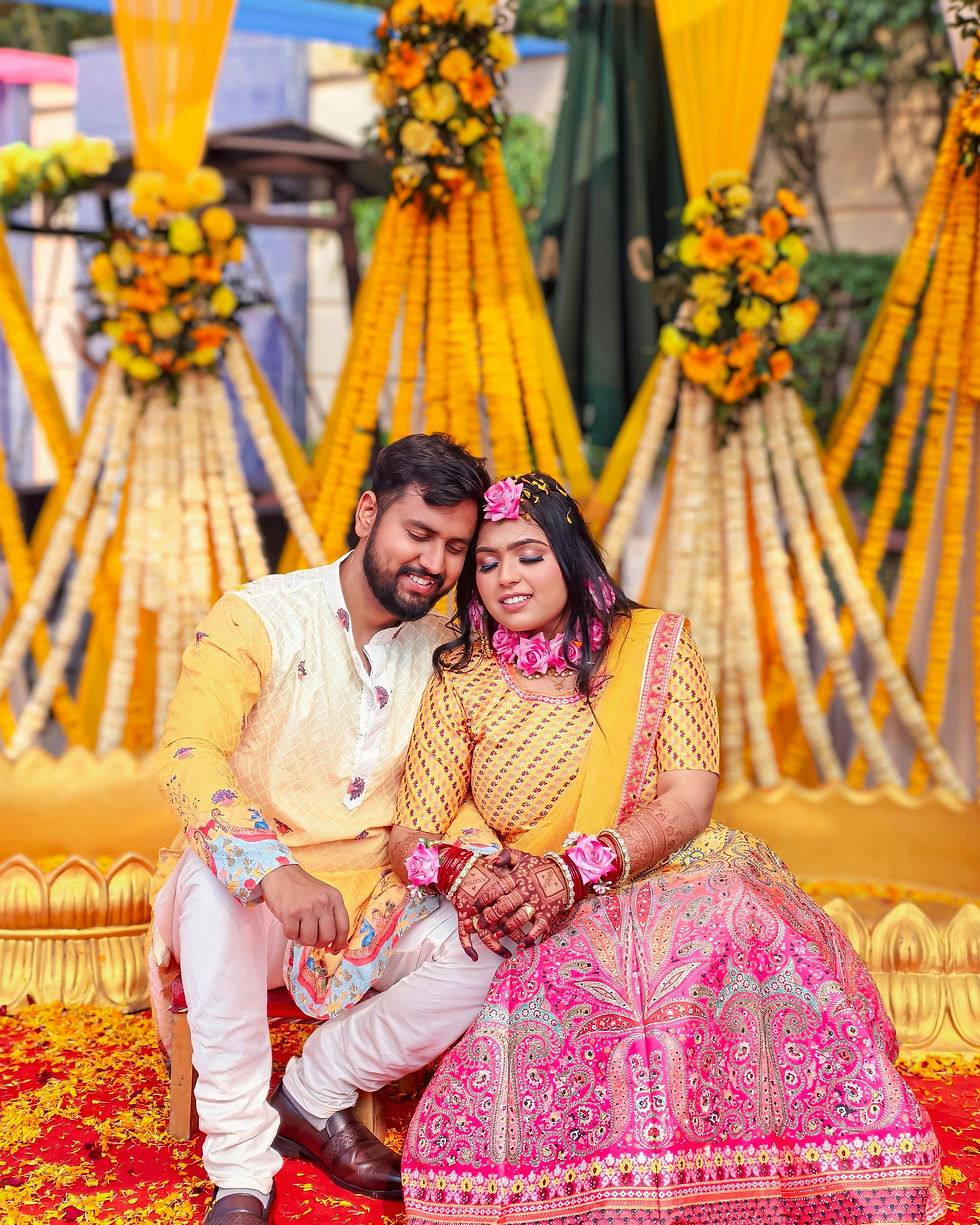 Couple entering Haldi event in yellow outfits