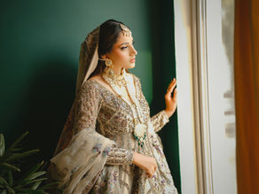 Minimal white lehenga featuring Mughal tree-of-life embroidery.