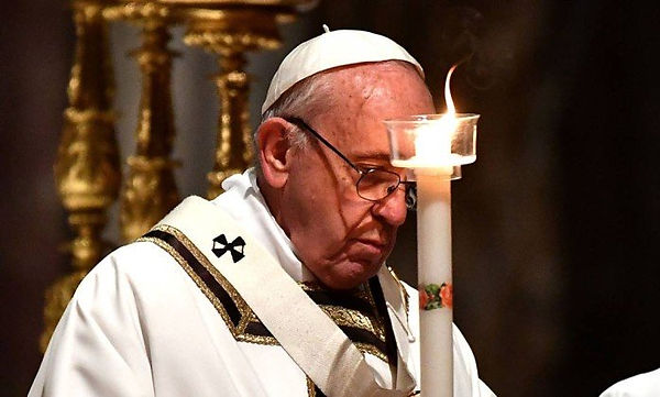 x74618720_Pope-Francis-holds-a-candle-wh