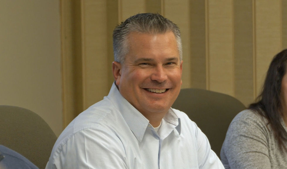 D.L. Evans Bank employee smiling in a traning setting